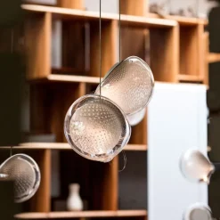 76.3